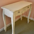 F29. Carved 2-drawer painted vanity with matching mirror. 31"h x 37"w x 16"d 